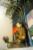 A modern bronze and gilt Buddha in realistic setting.<br>Shwezigon Zedi
