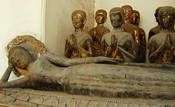 Reclining, with disciples.  Wat Arun 