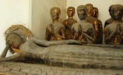 Reclining, with disciples.  Wat Arun 