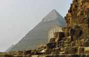 Khufu, Khafre, and Menakura Pyramids, with the Solar Boat building
