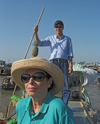 Thanh the guide, and Gloria<br>  The pineapple on a bamboo indicates what the boat has for sale.