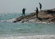 Fishermen on one end of the beach. (746x530, 93.2 kilobytes)