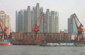 The apartments behind have this view of Pudong's port.