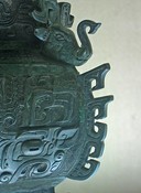 Decorations on a four-sided ancient bronze jar