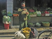 He's put down his bundles on Dajing Lu, an old-style shopping street in the 
