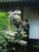 The karst is decorated with bamboo, grass ... and a mop