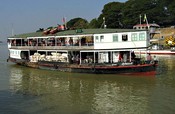 A combination ferry and cargo ship heads upstream