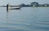 Fishing with a conical net on Inle Lake