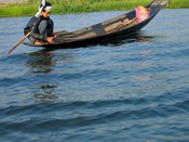 Line fishing from his canoe.