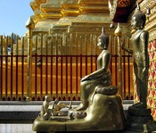 Bronze Buddhas in front of the chedi.