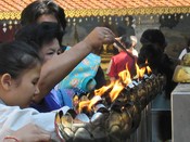 Pouring water on or next to the flames