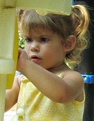 In the playground, Rosie practices dialing the phone